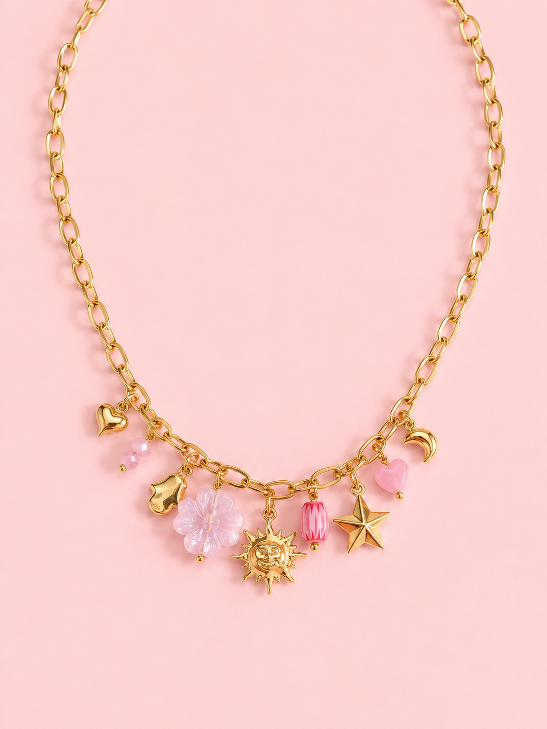 Bora - Collier doré à charms soleil étoile rose