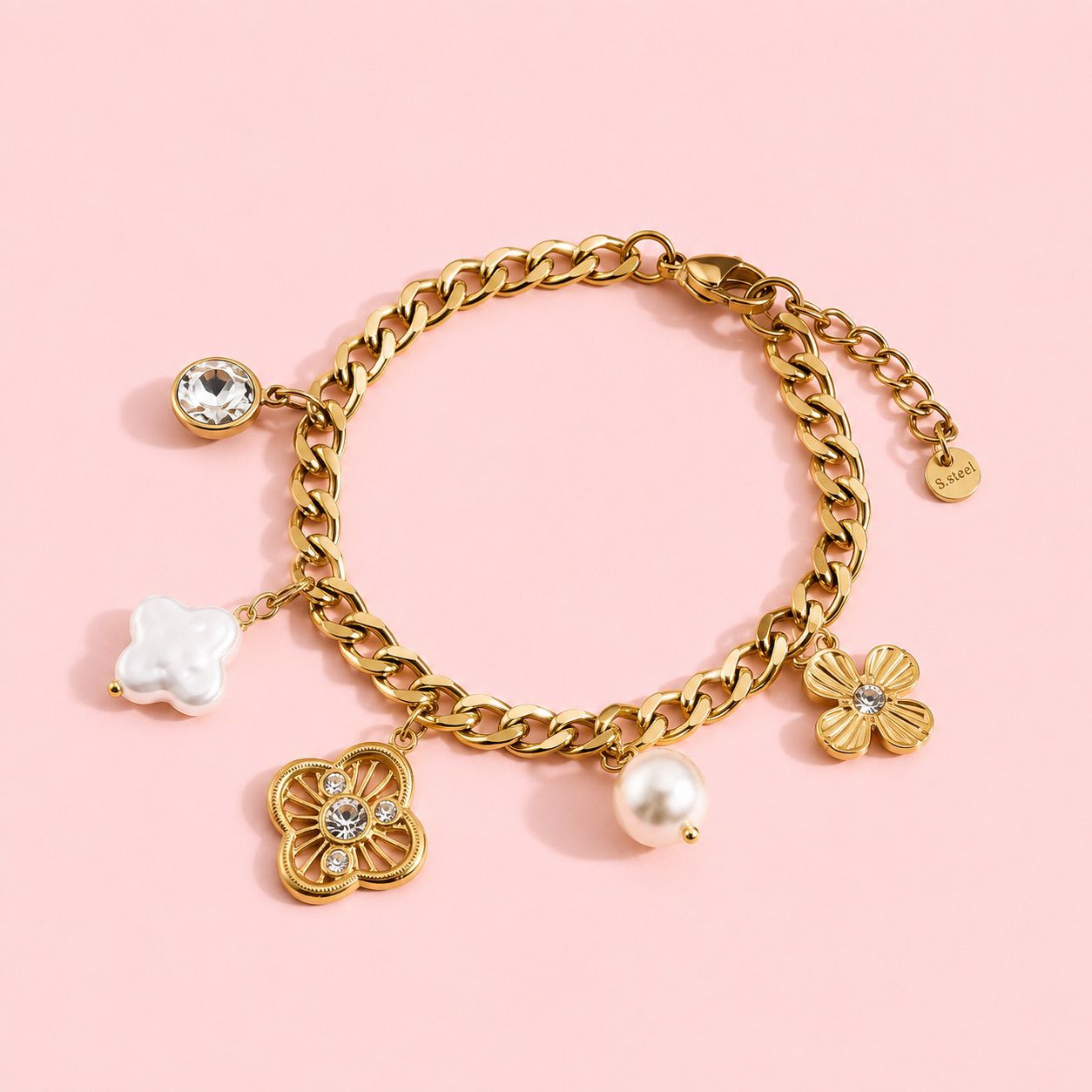 Marina – bracelet doré à charms trèfles et strass rond